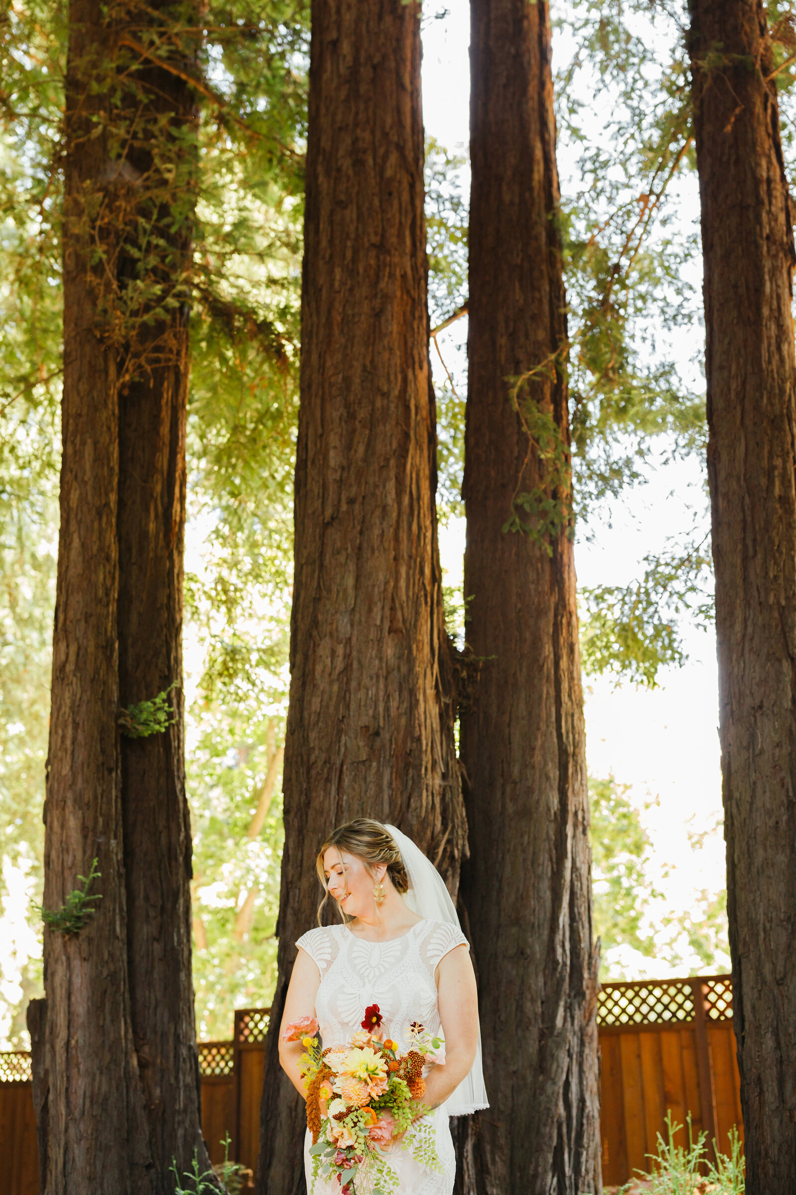 Bride on her colorful wedding day in Santa Cruz, California in the redwood trees.