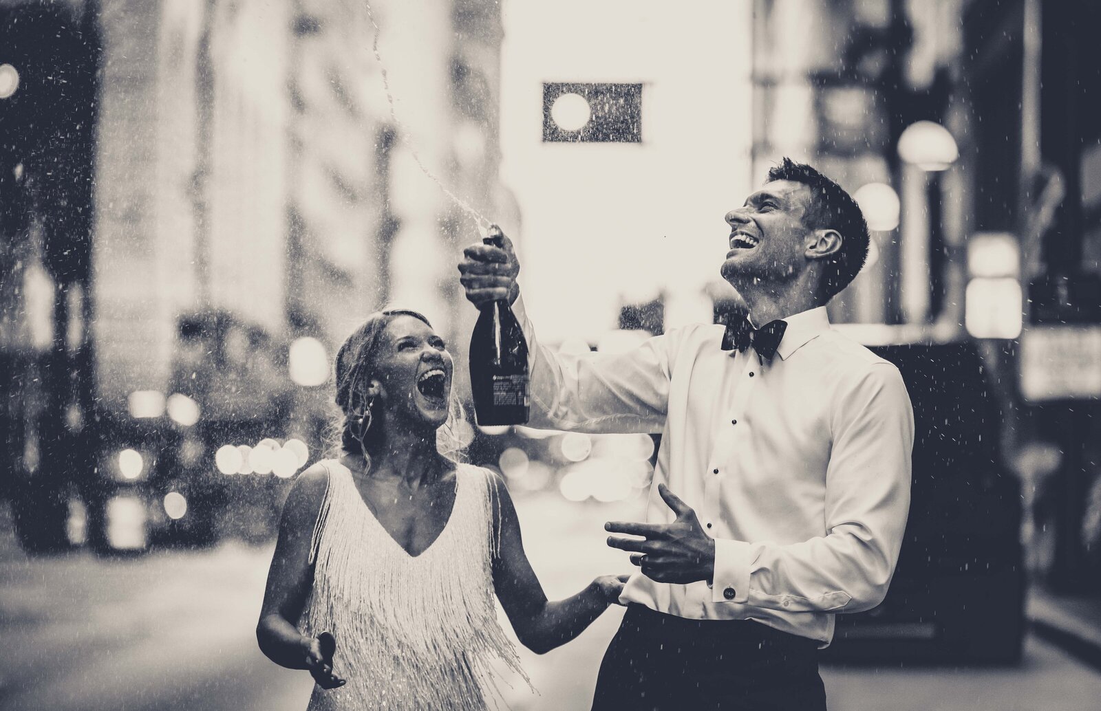 Feel the excitement of Hailey and Peter's wedding celebration with this vibrant photo capturing a joyful champagne pop in the bustling streets in front of the Renaissance. The energy of the moment is palpable as champagne sprays into the air, symbolizing the start of their new life together amidst the urban backdrop. Perfect for couples seeking dynamic, lively wedding photos that capture the essence of celebration, this image showcases how even traditional elements like a champagne toast can be transformed into a unique and memorable event.