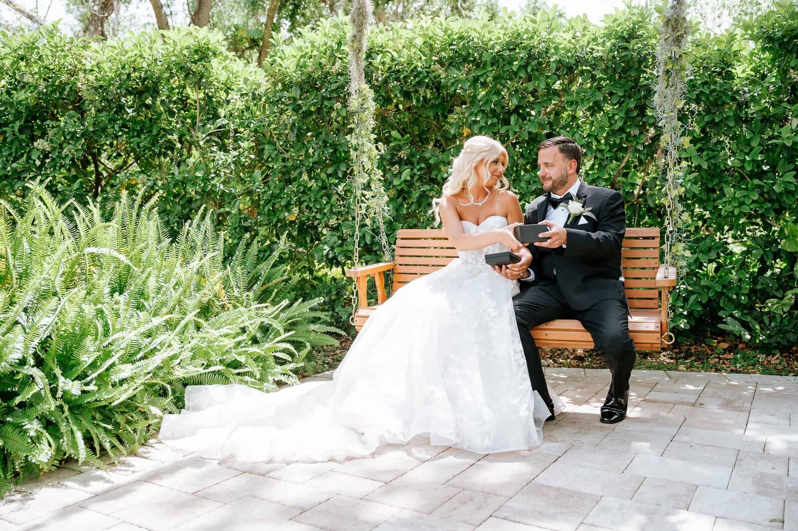 Candid photo of the couple sharing a quiet moment under the oak trees.