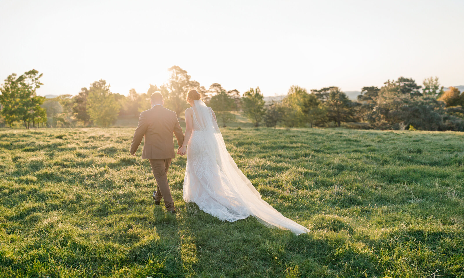 Bride and  groom walking off into the sunset in Canberra