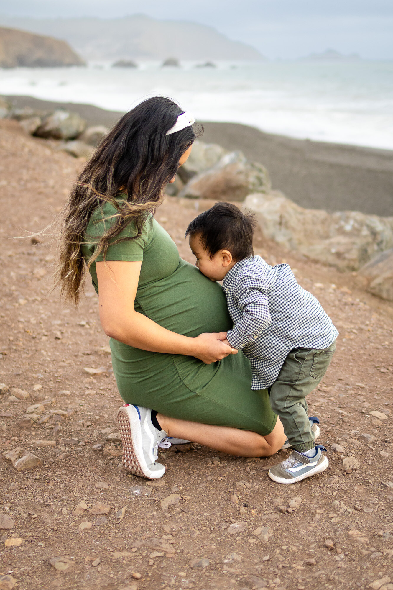 weet moment of a toddler kissing his pregnant mama’s belly by the coast – Book Bay Area Family Photographer - Ellobelle Photography