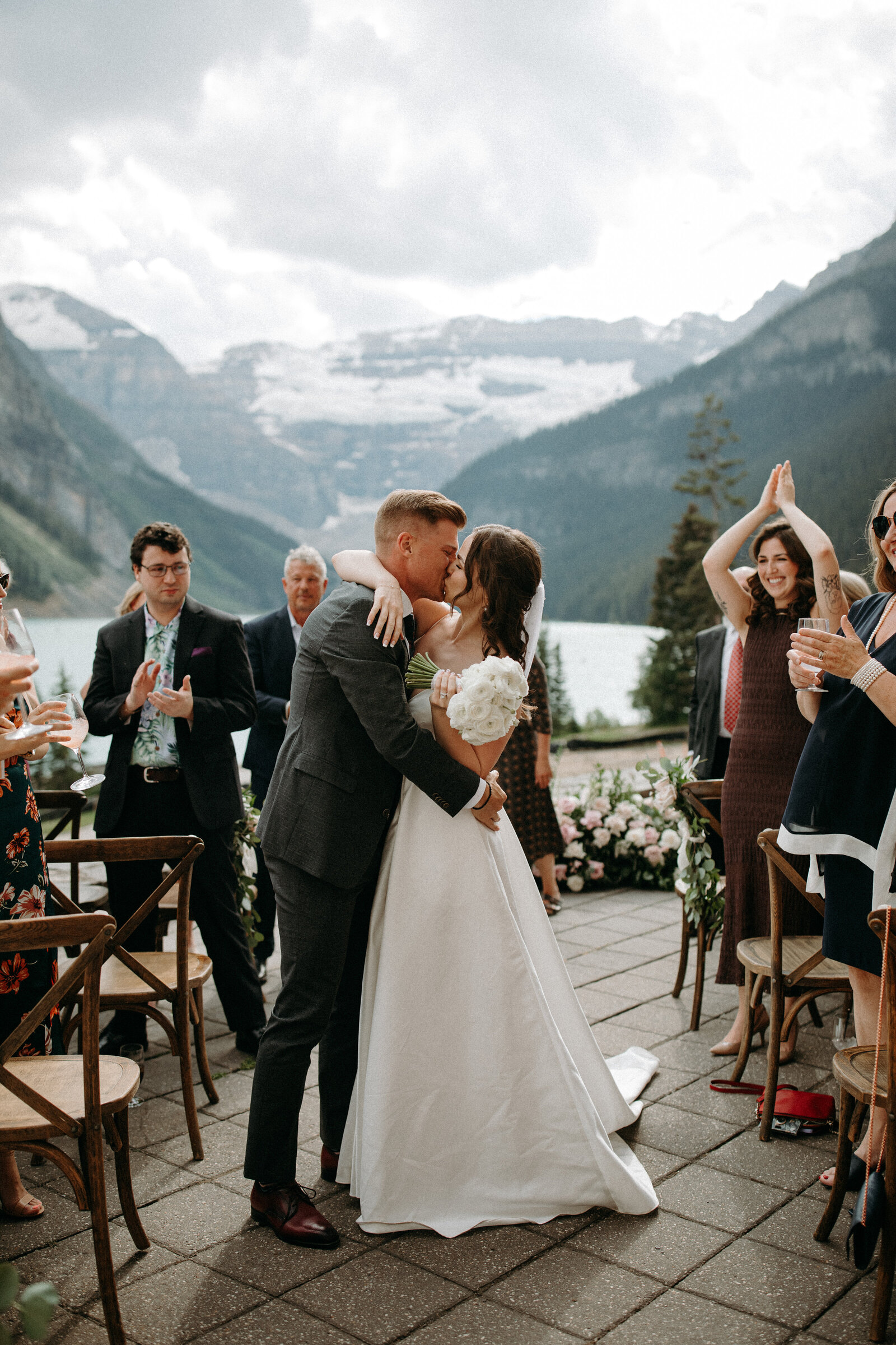 couple kissing with Canadian Rocky Mountains in the background