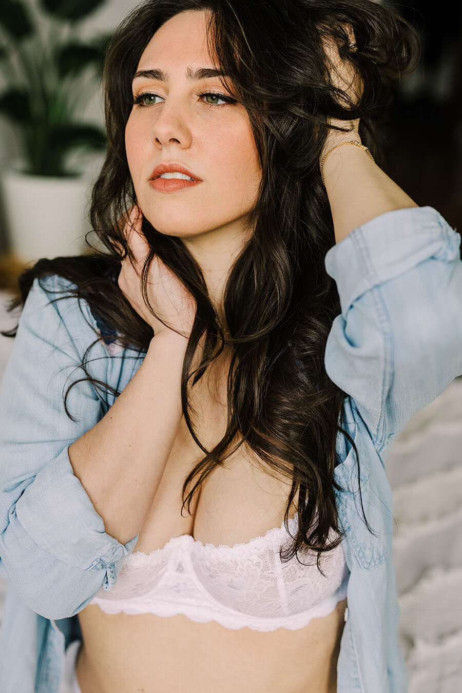 A boudoir shoot with white lingerie and a chambray button down shirt.