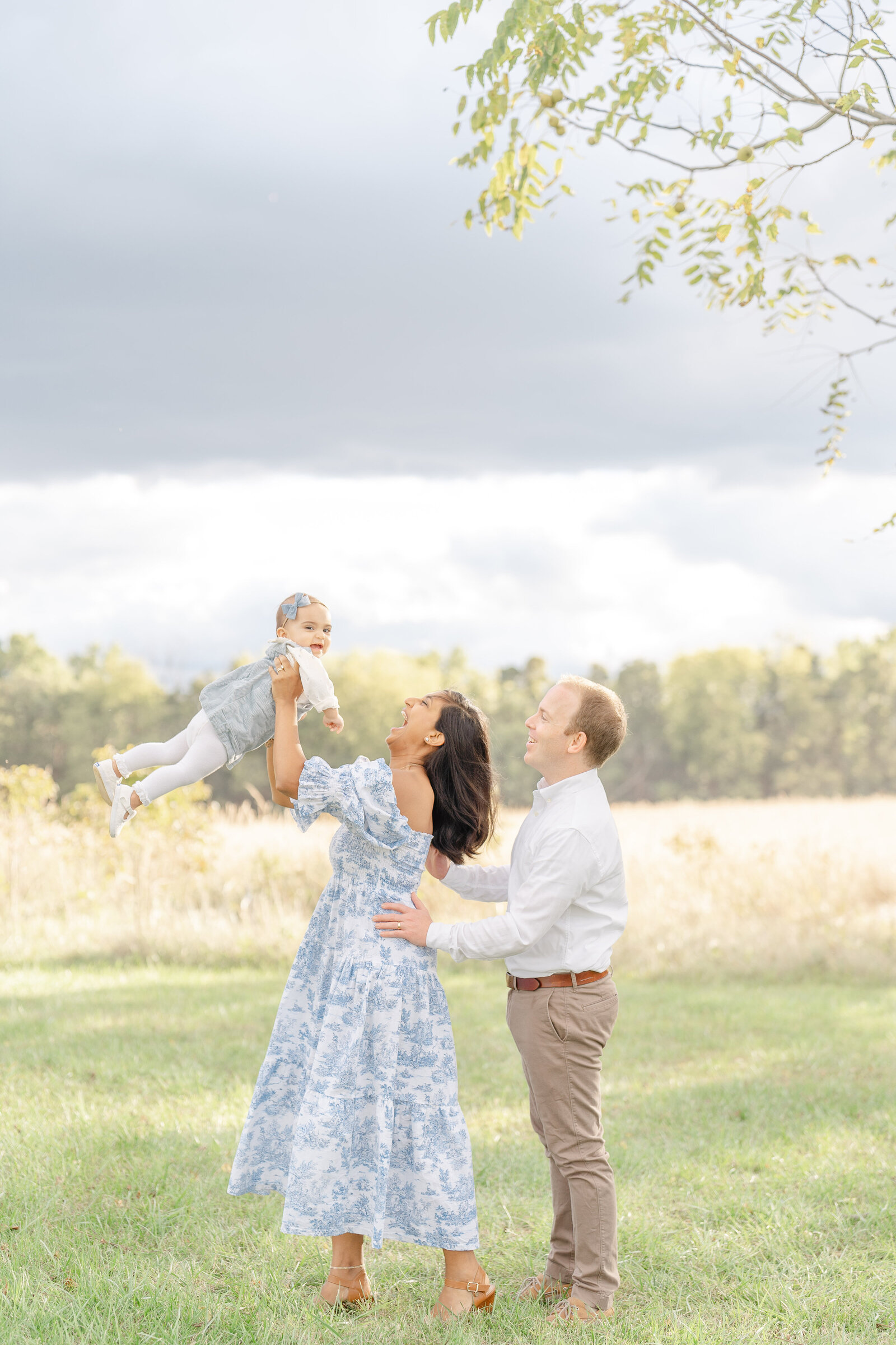 parents playing with baby during Sterling, Virginia family photo