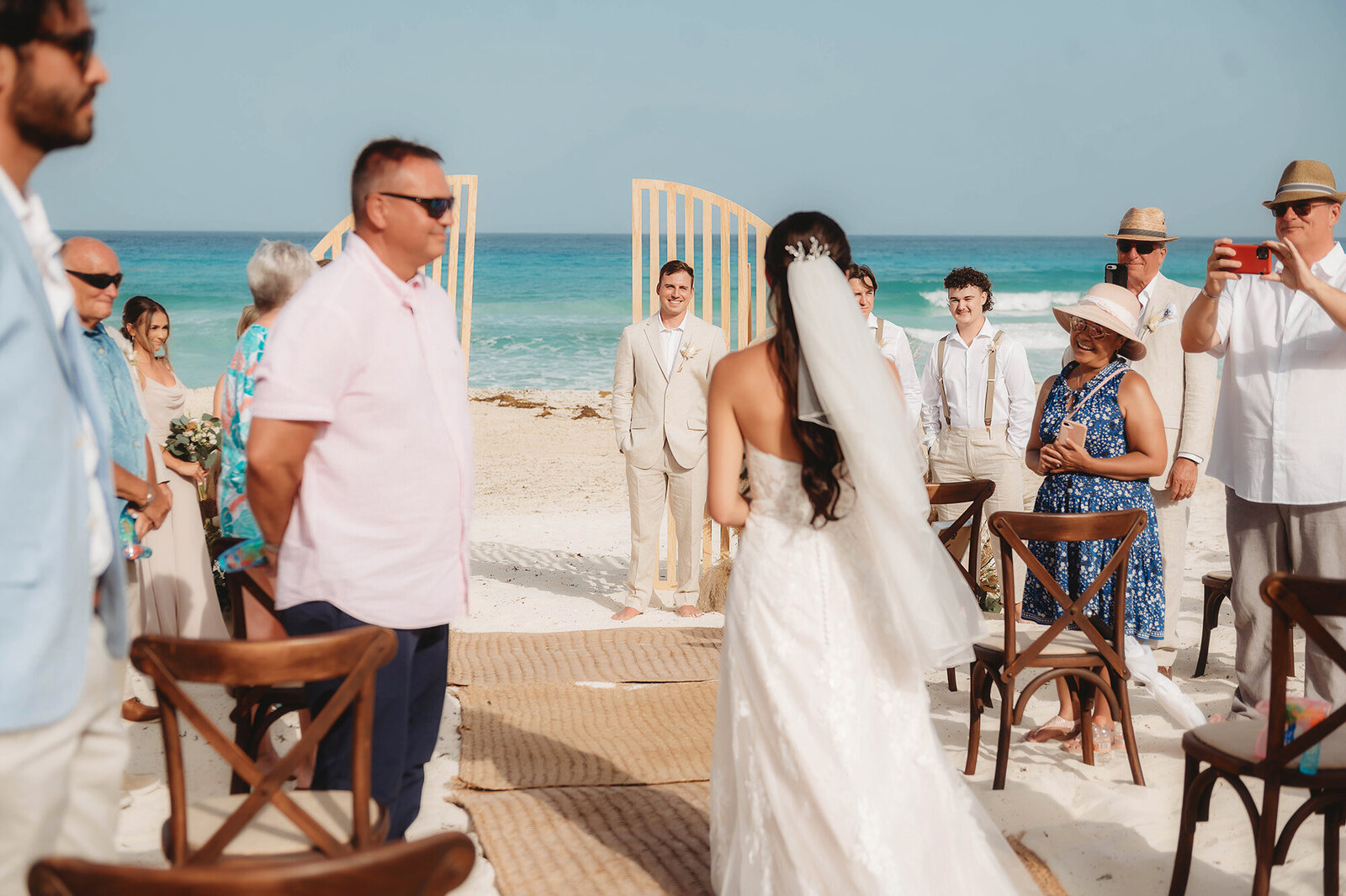 Bride walks down the isle for her Micro-Wedding at Live Aqua Resort in Cancun Mexico.