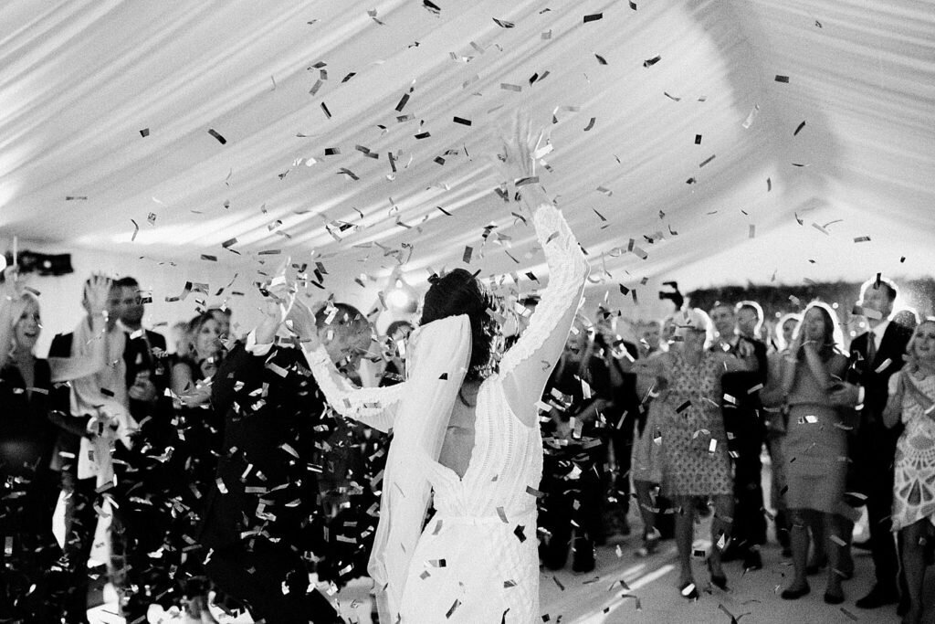 Bride dancing in confetti