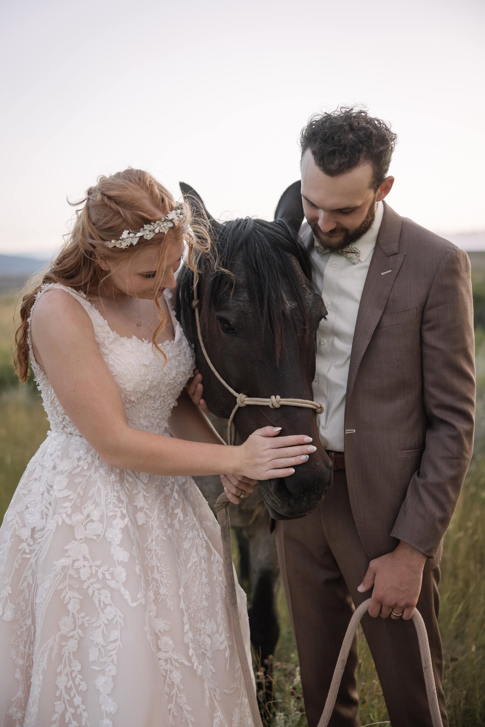 bride and groom photos with horse on a ranch