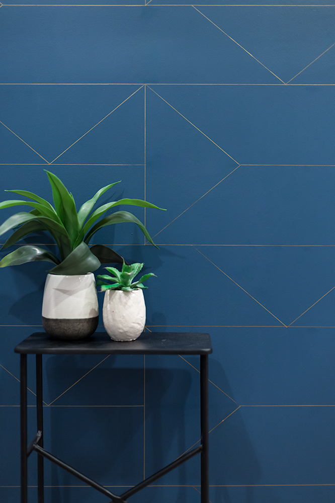 Art deco style wall with bright blue and gold design