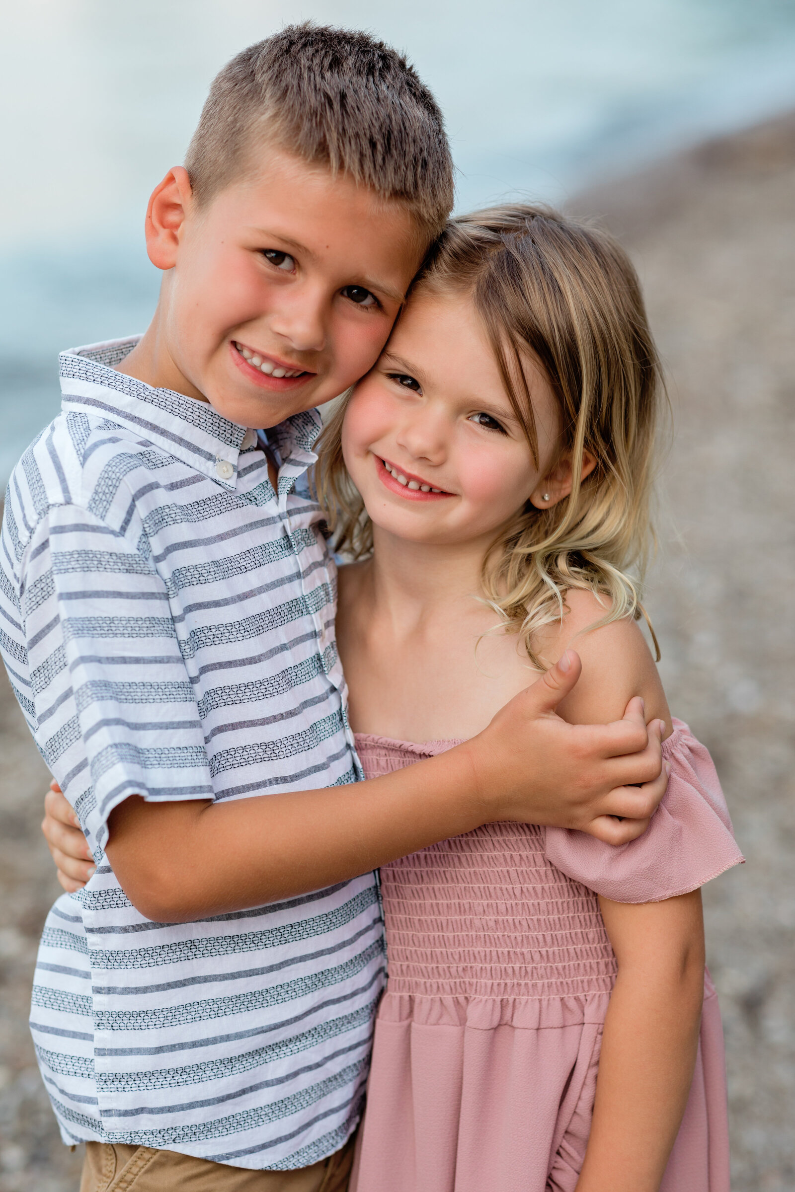 brother and sister hugging for family photos
