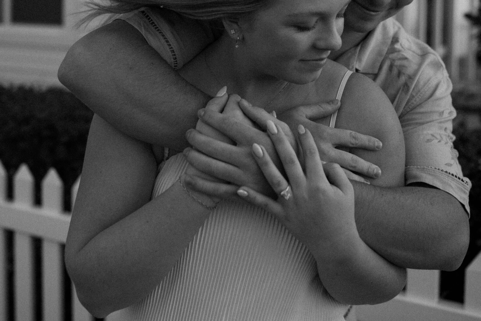 A close up photo of a couple embracing during a photography shoot.