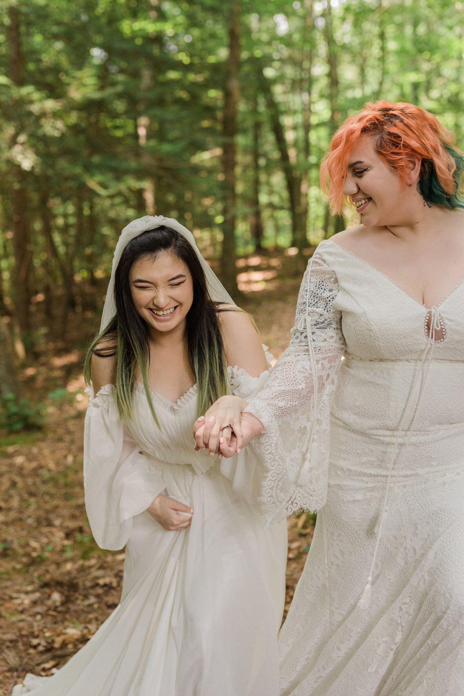 Same sex LGBT couple laugh and look happy during their elopement in Central Kentucky