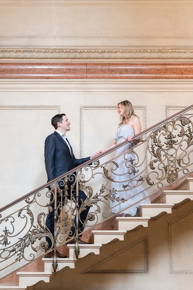 Engaged couple on grand staircase at Larz Anderson House in Washington DC.1