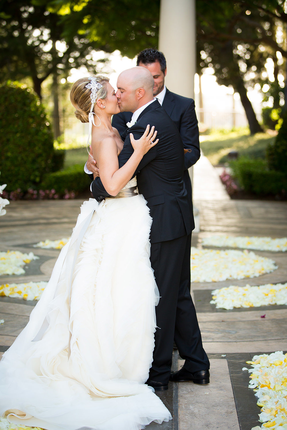 Make it a good one!  Bride and groom embrace as husband and wife for the first time