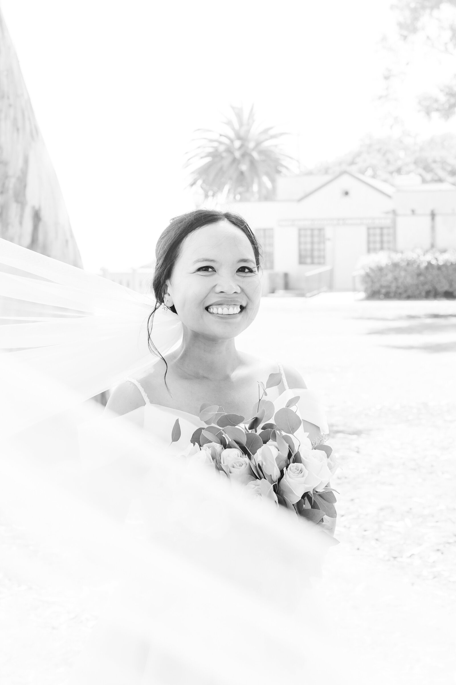 A bride holds her bouquet before her wedding ceremony.