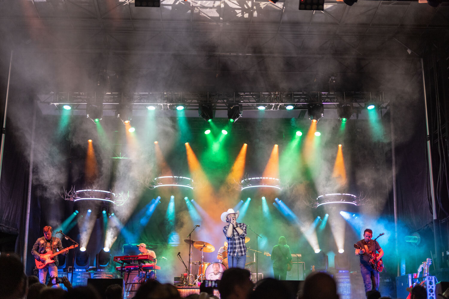 Musician performing on a colorful stage