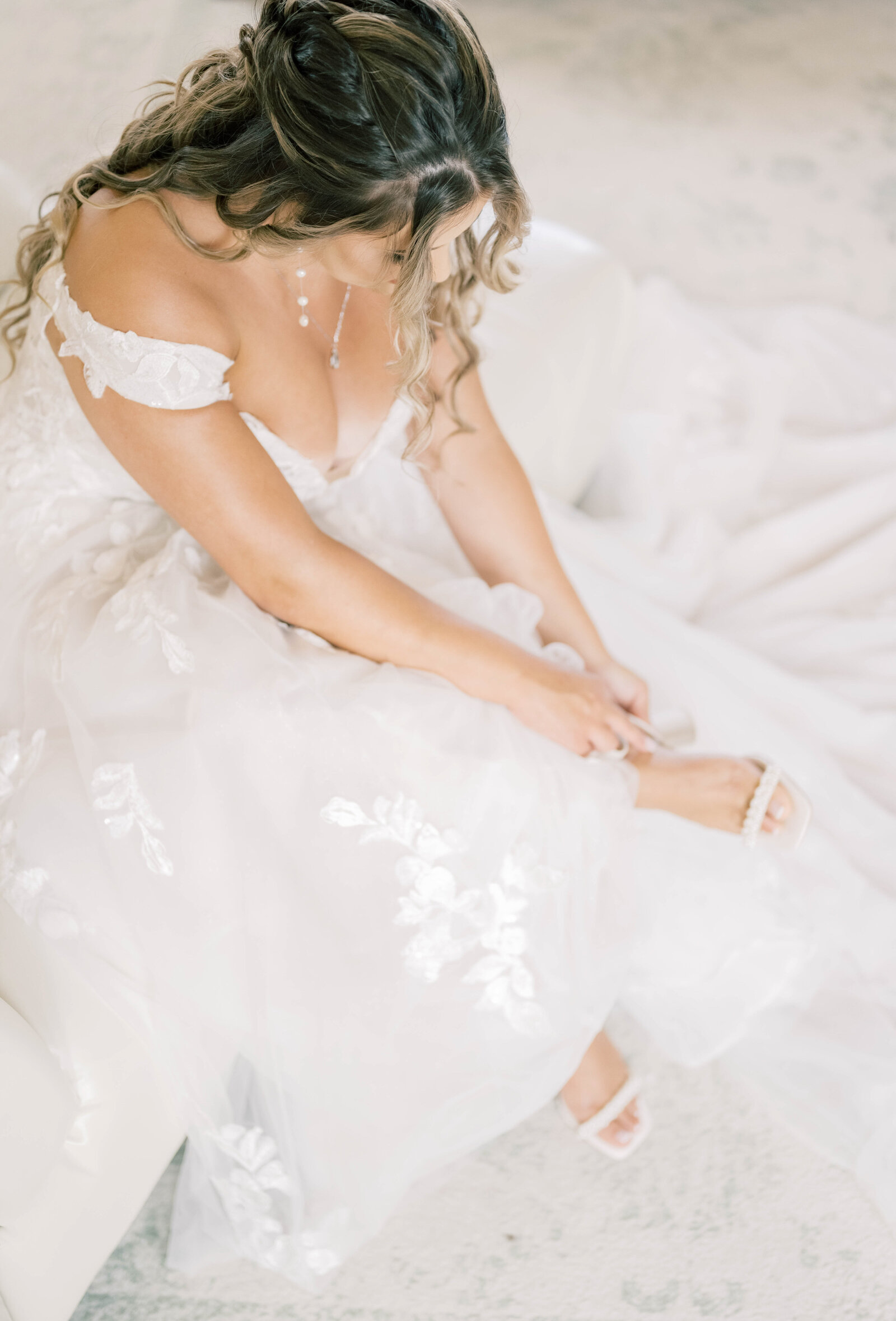 a bride putting on her shoes