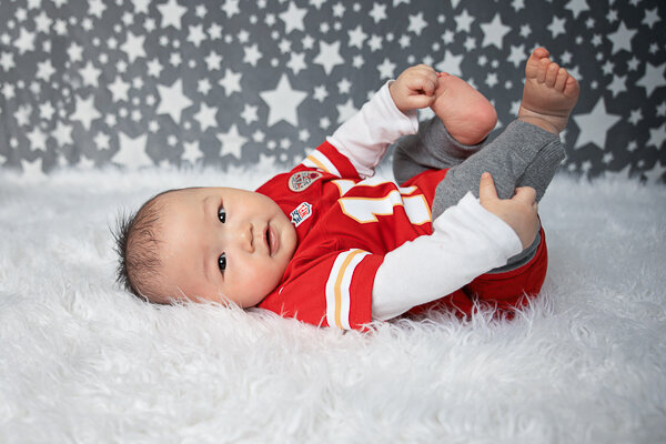 East Brunswick NJ Baby Photographer Sitter Feet Up Pose