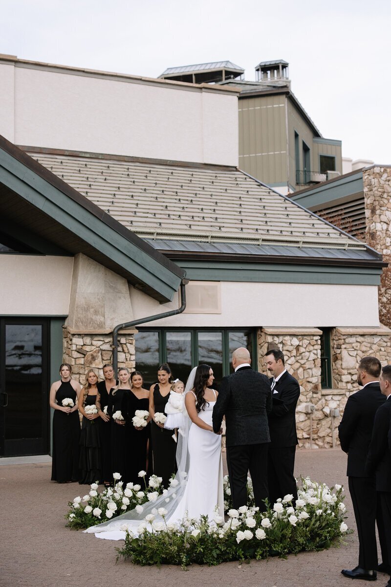 bridal party in front of venue by idaho elopement photographer