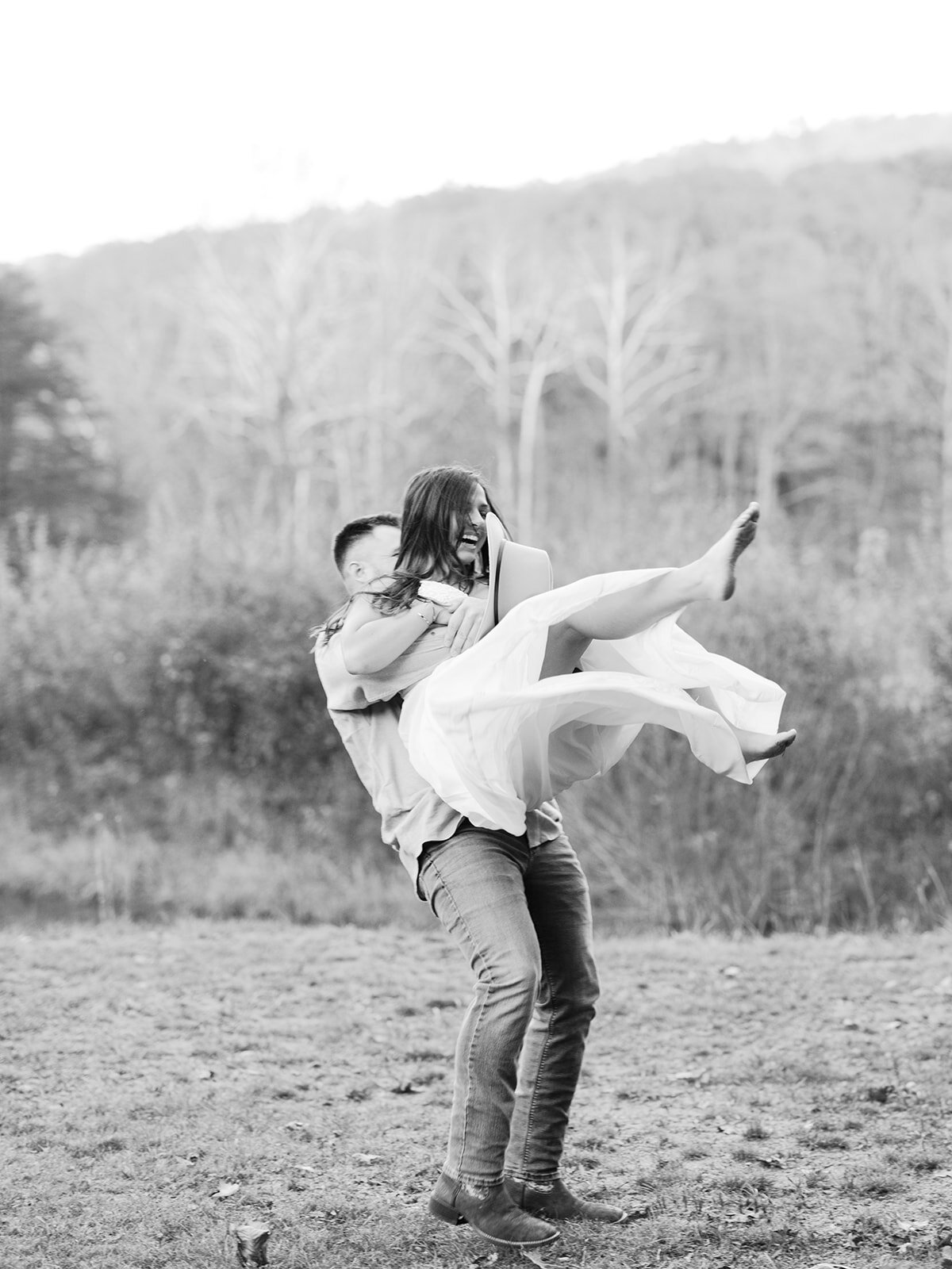 Couple spins around  with joy