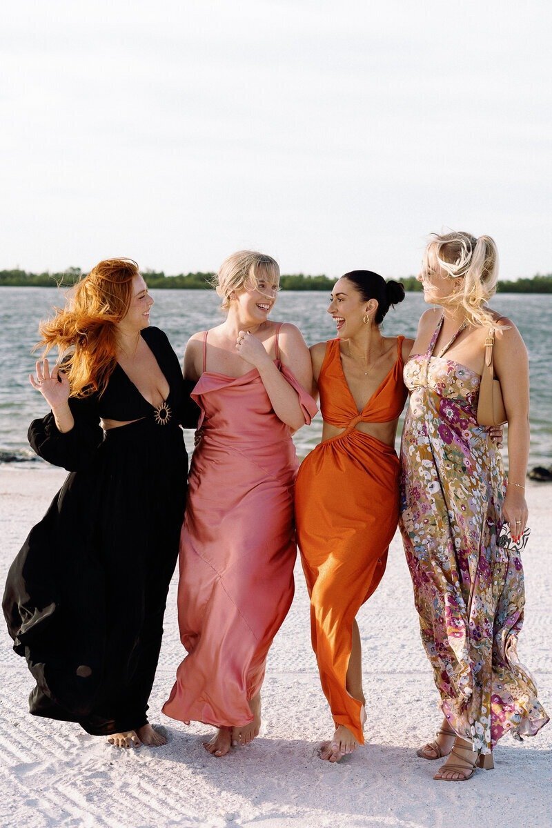 four girls with arms around each other taken by wedding photographer fort myers