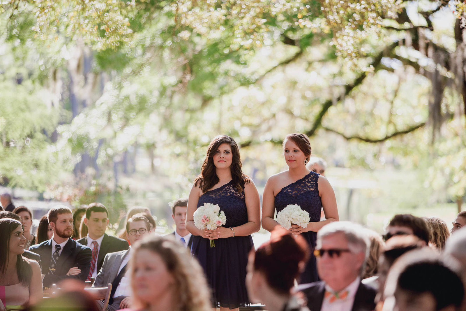 Bridesmaids walk up aisle, Brookgreen Gardens, Murrells Inlet Wedding Photographer.