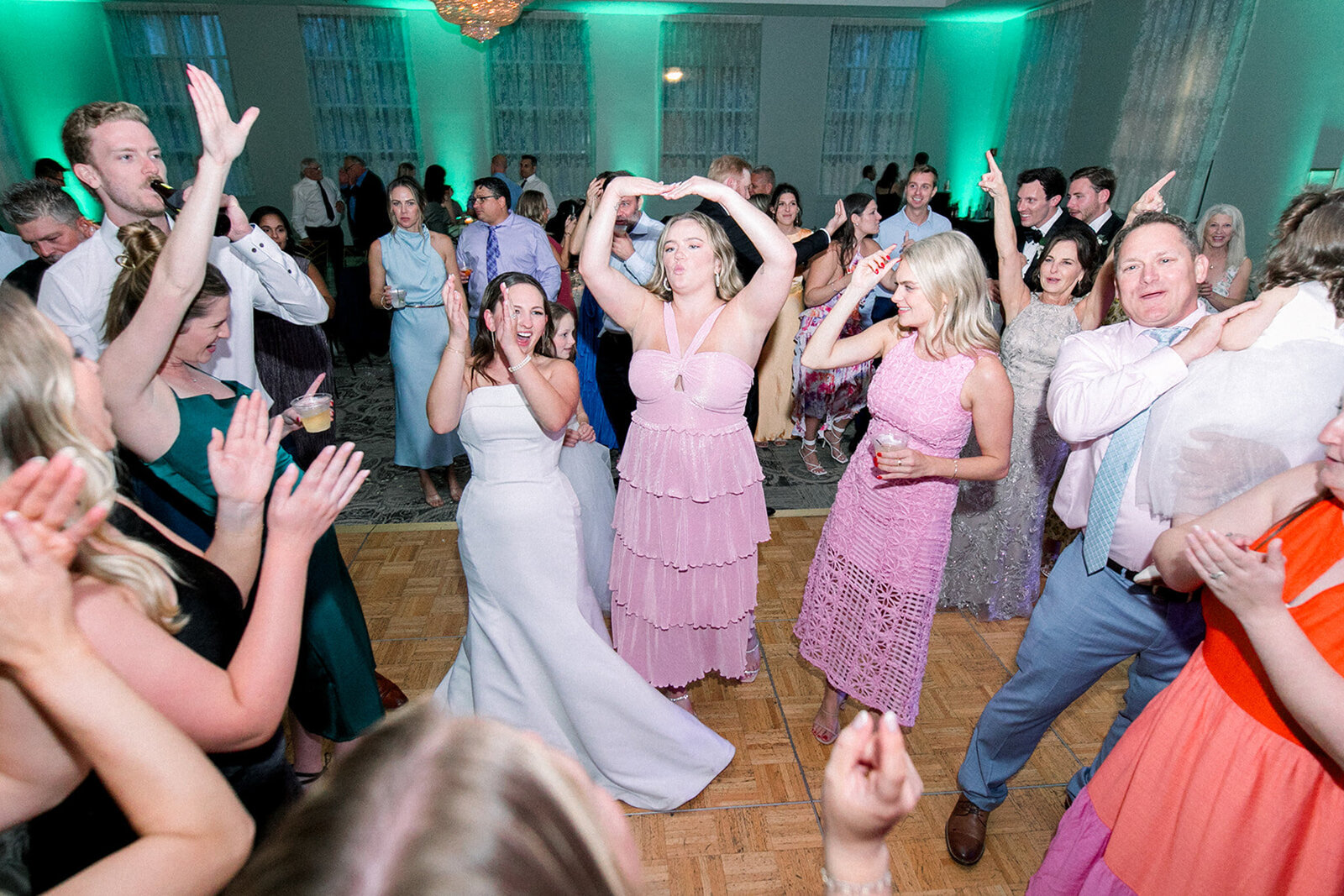 Bridesmaids and wedding guests dancing at Chicago wedding with Charizma DJ