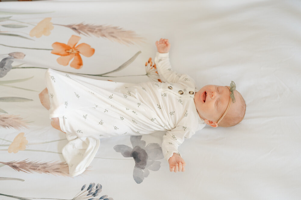 baby in the crib sleeping during McLean, VA newborn picture