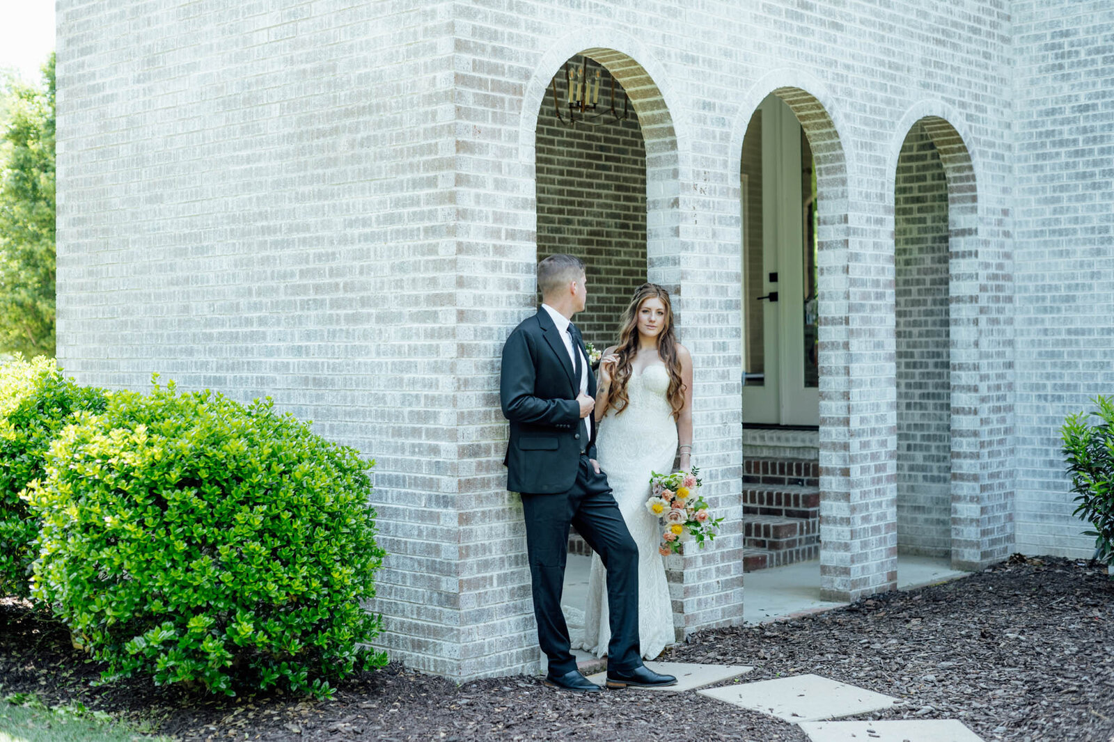 Bride and groom photo in the corner of the wall