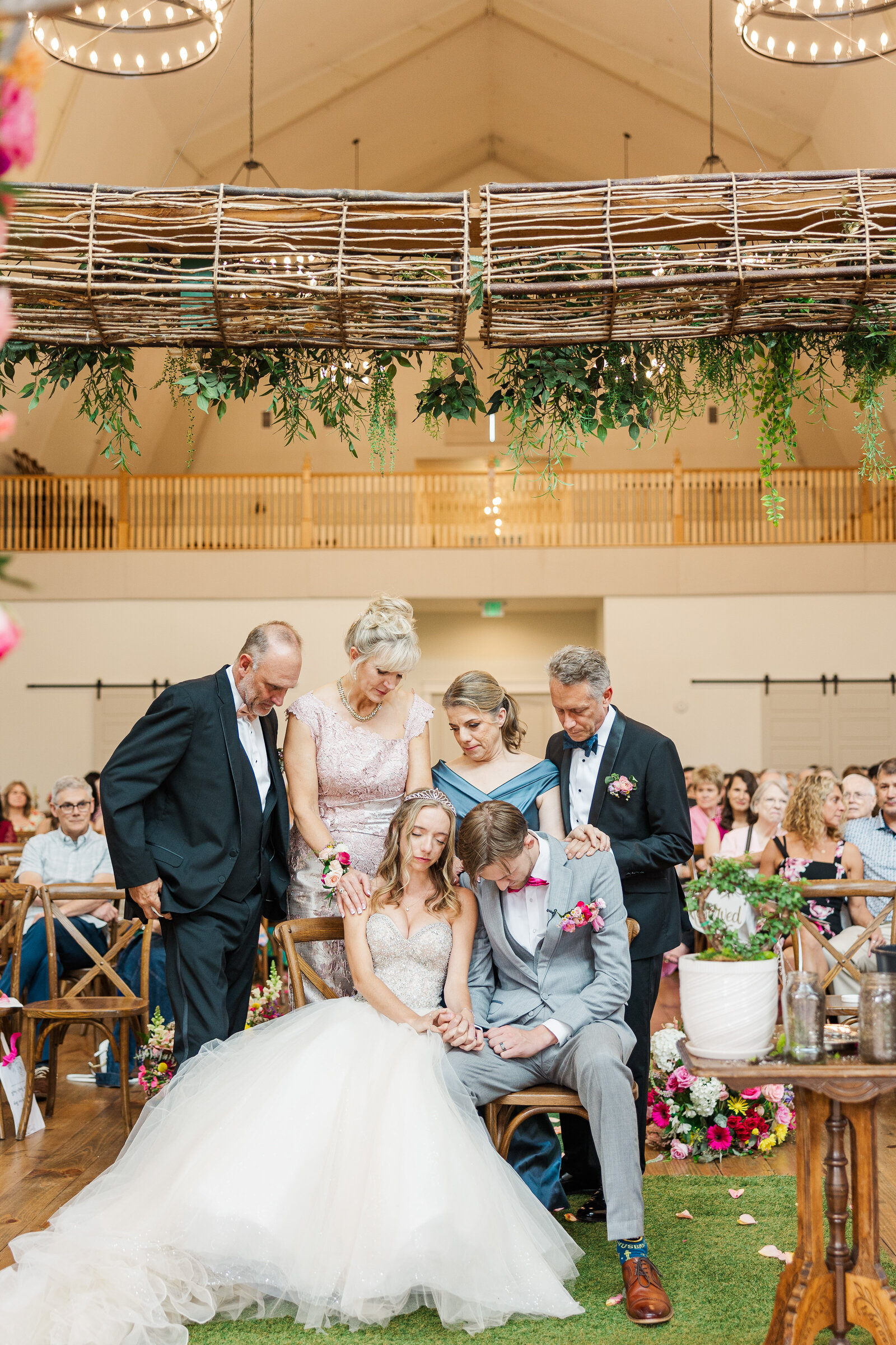 Bride-and-groom-sitting-for-prayer-ceremony