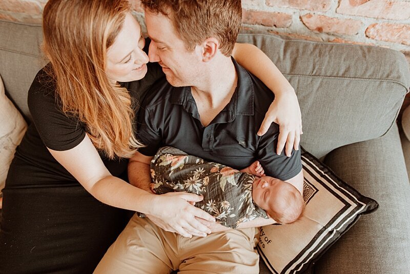 mom and dad with newborn baby at newborn photography session
