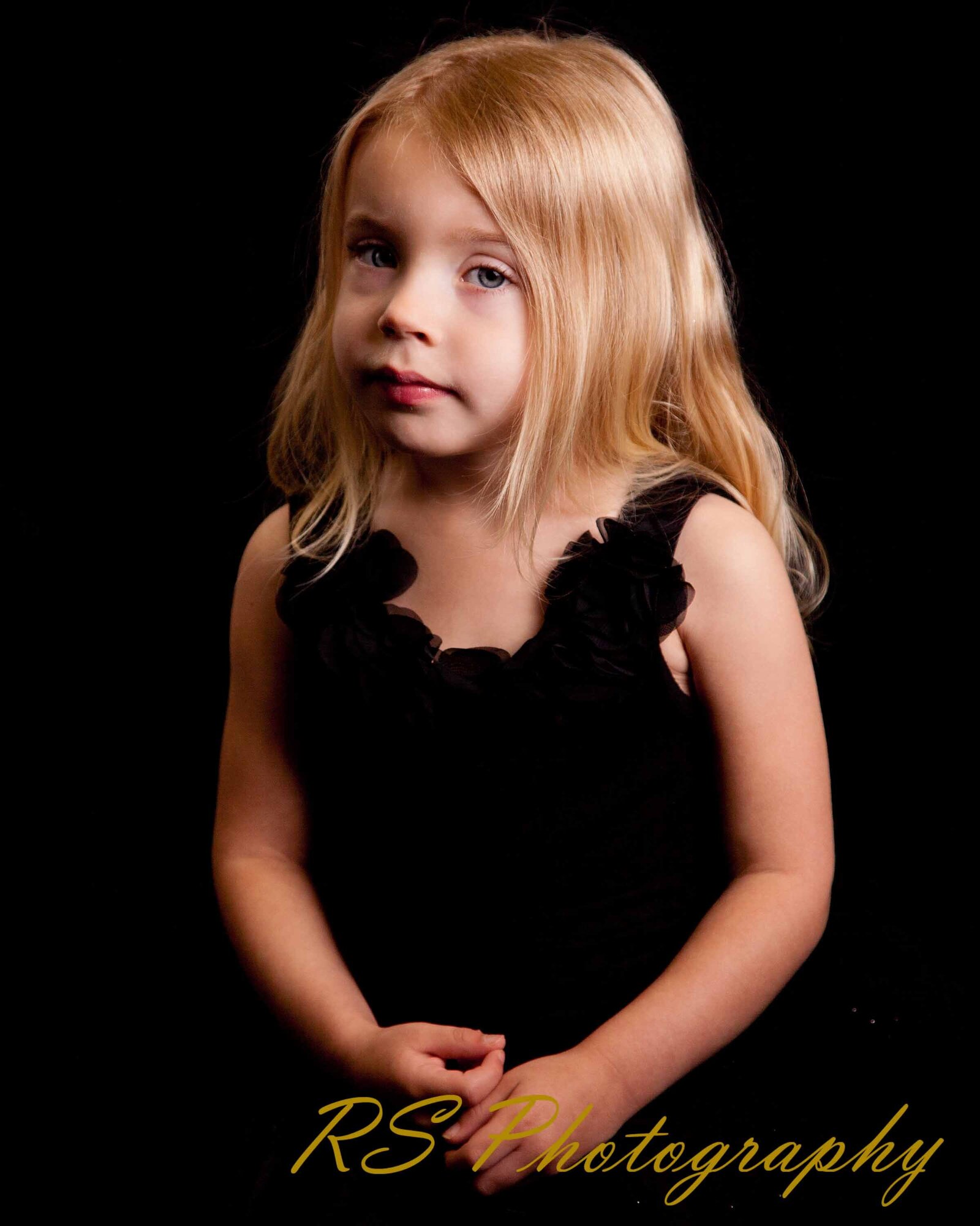 Young girl posing in studio shoot with Ron Schroll Photography in Asheville, NC