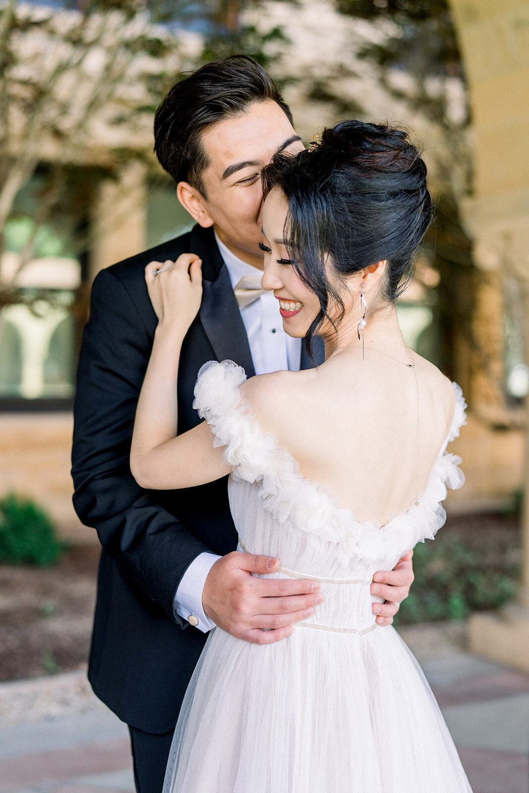 A romantic moment between the bride and groom at their wedding at Stanford University, California.