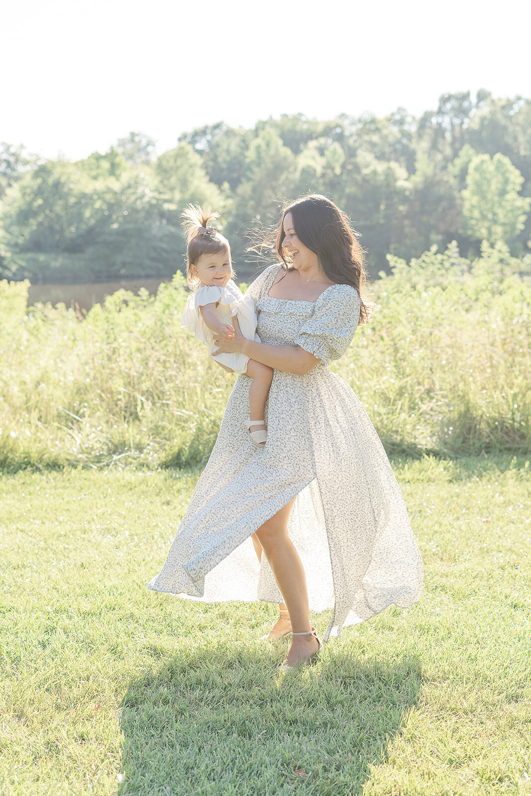 mom twirling with daughter in Haymarket, VA