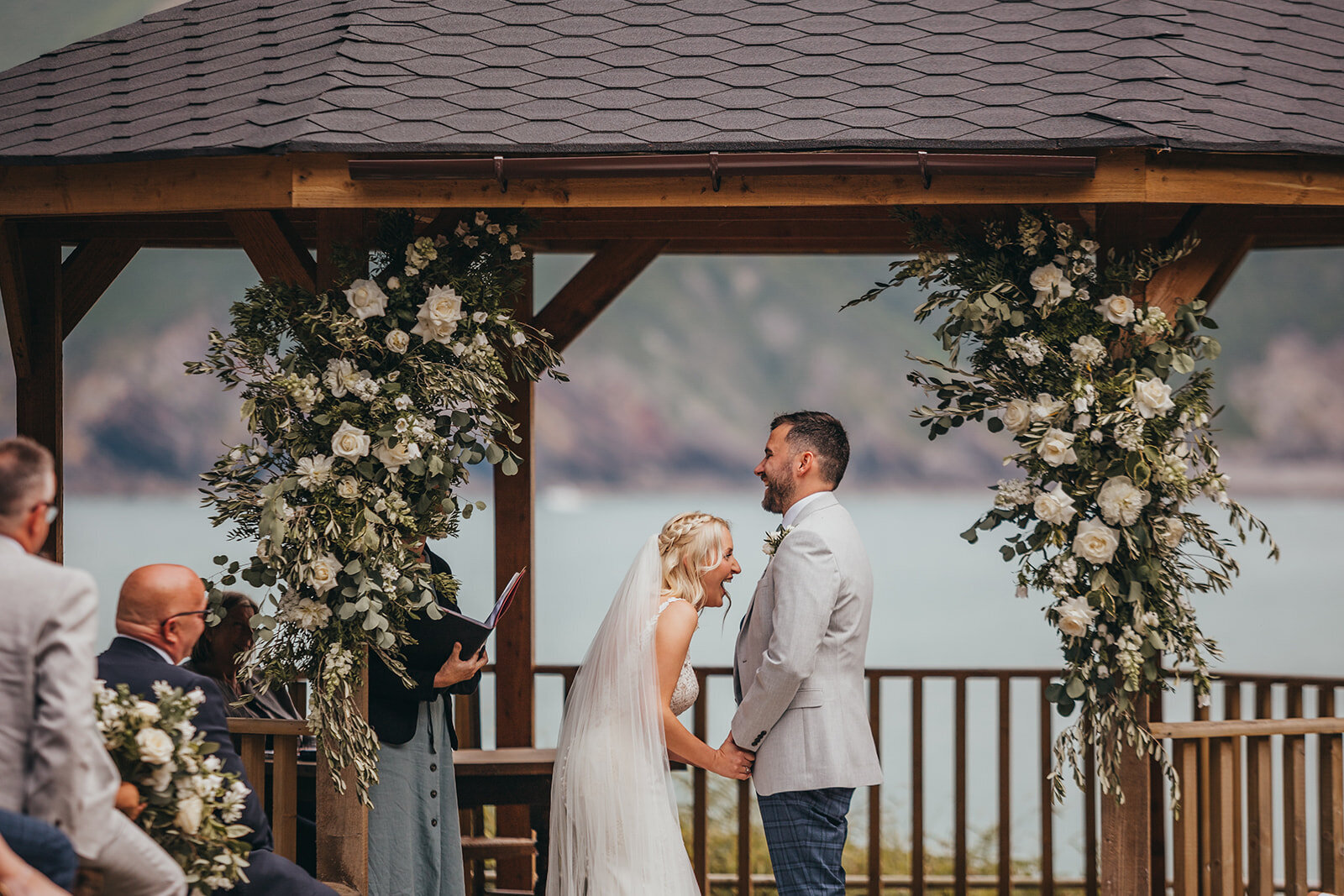bride and groom laugh during ceremony