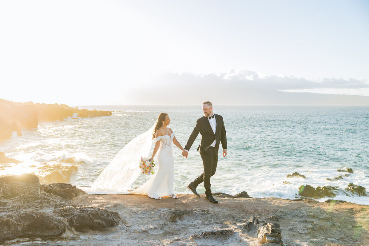 Bride and groom standing Ocean Side