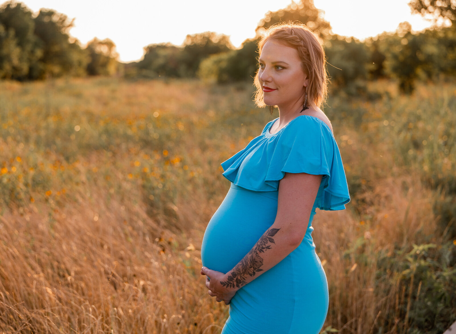 maternity mom in blue at golden hour
