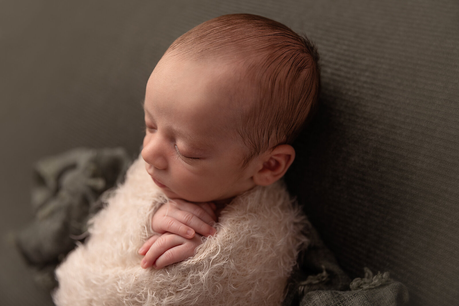 baby sleeping with hands out by Newborn Photography Bucks County PA