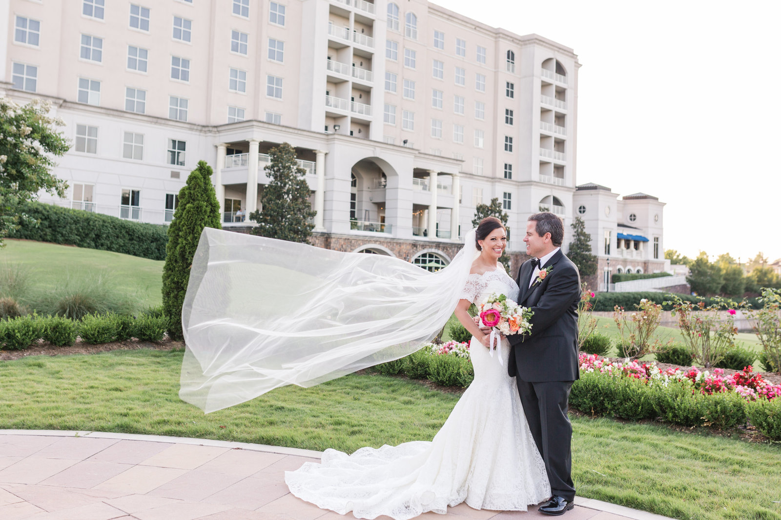 mother walks hand in hand with daughter and holds small child at Myrtle Beach beautiful moment with family photographer jamie lucido