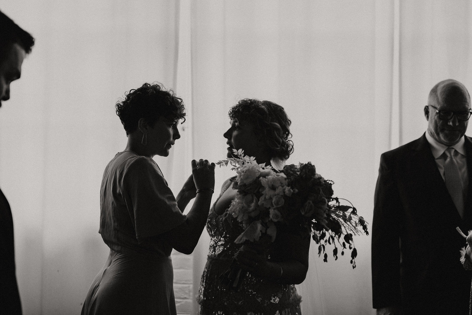 Touching wedding photo of bride and mother of the bride