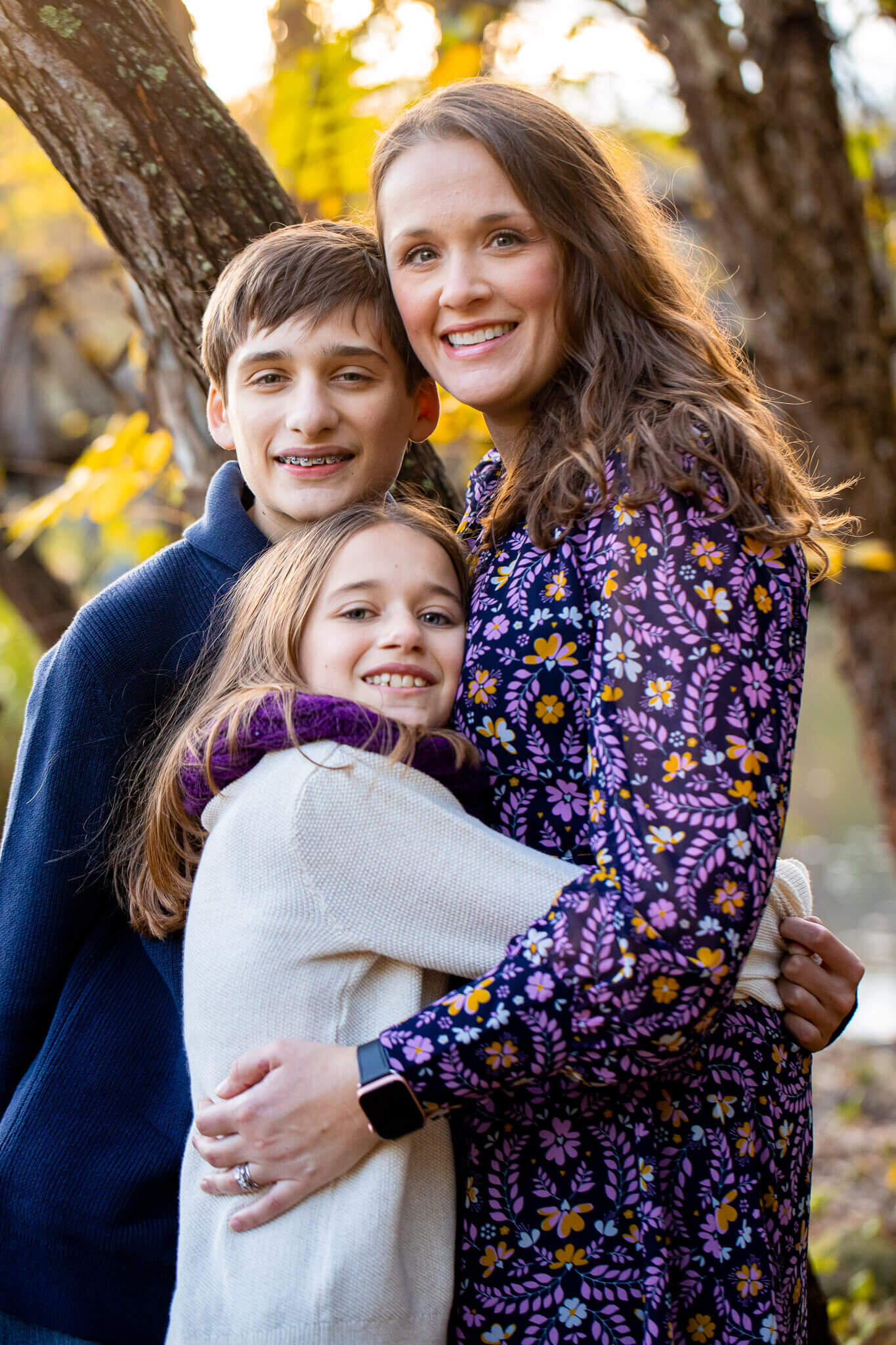 A mom snuggling with her two kids during a Springfield family photo session.