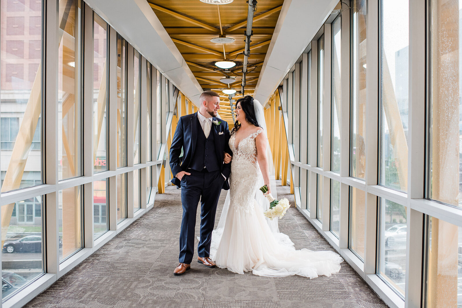 bride and groom on skybridge