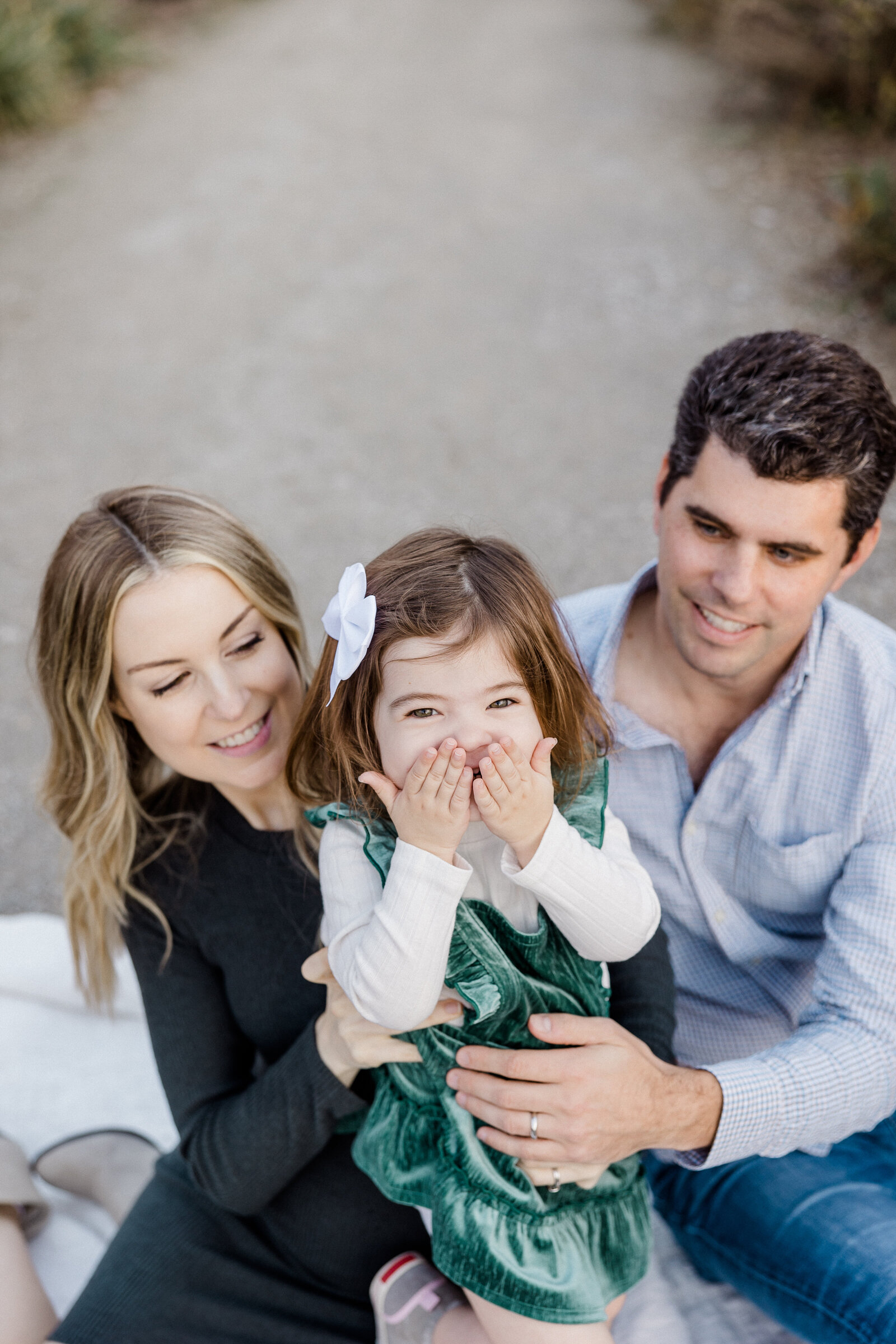 toddler girl giggling during family photos