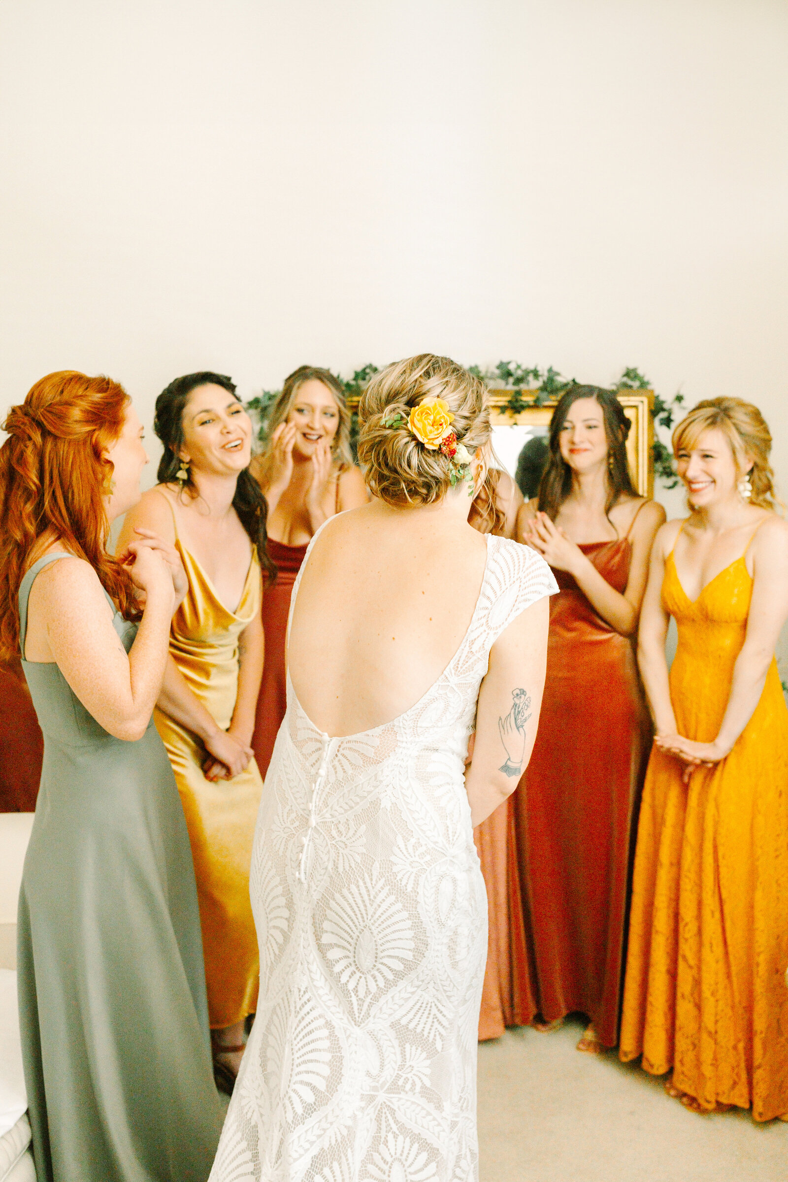 Bride getting ready on her colorful wedding day in Santa Cruz, California in the redwood trees.