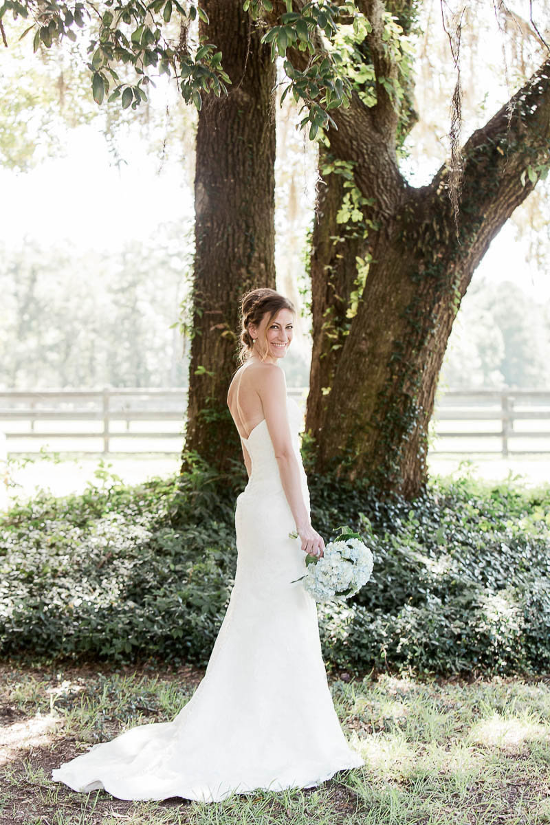 Bride poses under the oak tree, Pepper Plantation, Awendaw, South Carolina
