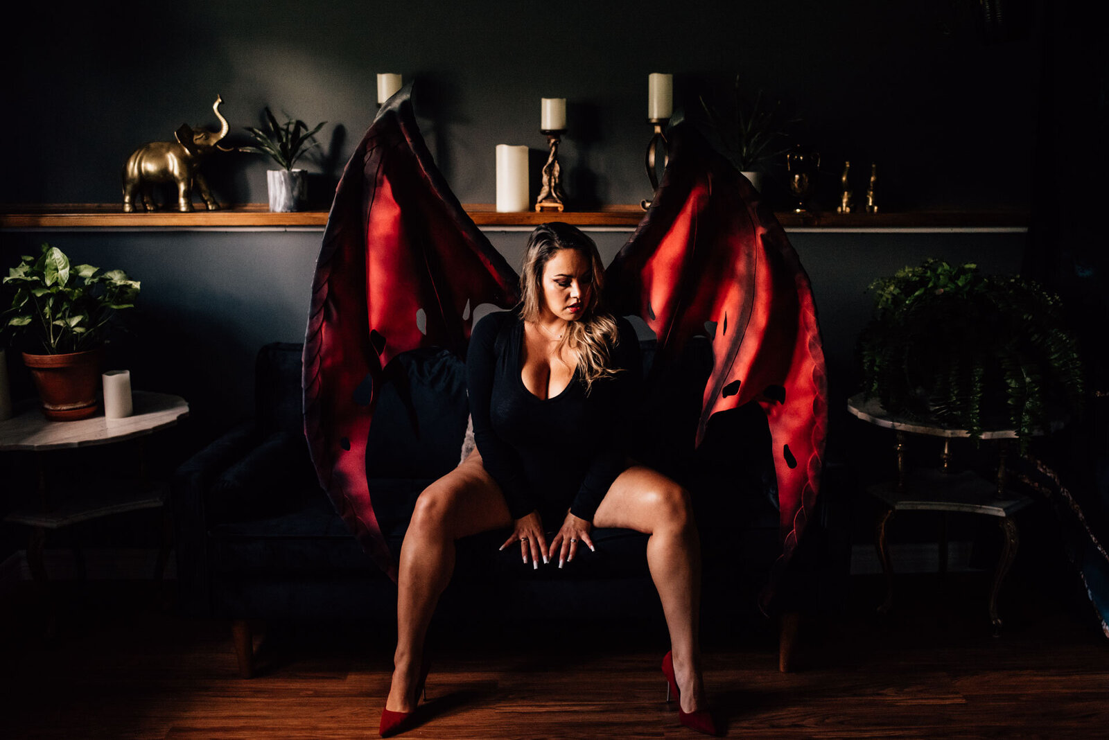 woman wearing devil wings for boudoir photos in Ottawa