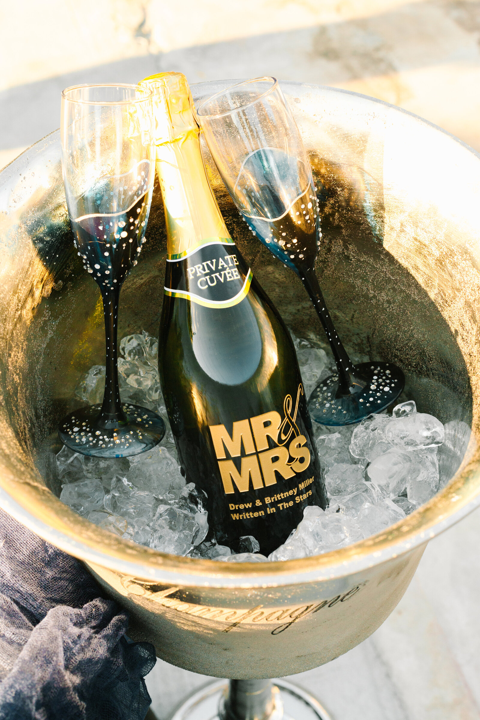 Customized bottle of champagne for the newlyweds.