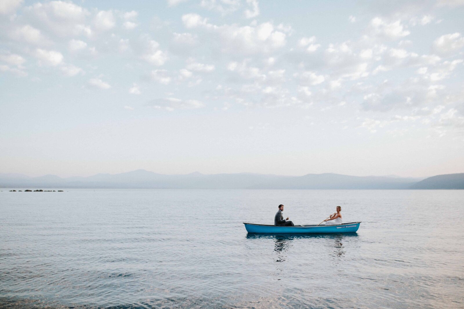 Sacramento Wedding Photographer captures bride and groom in canoe after Lake Tahoe elopement