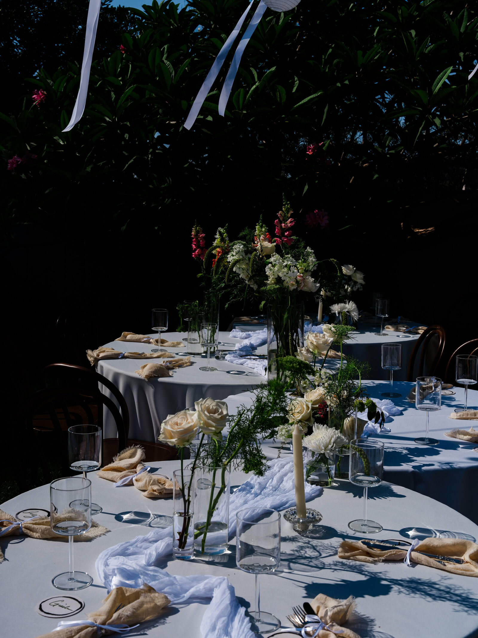 Wedding reception tables decorated with florals candles etc for outdoor wedding in San Diego