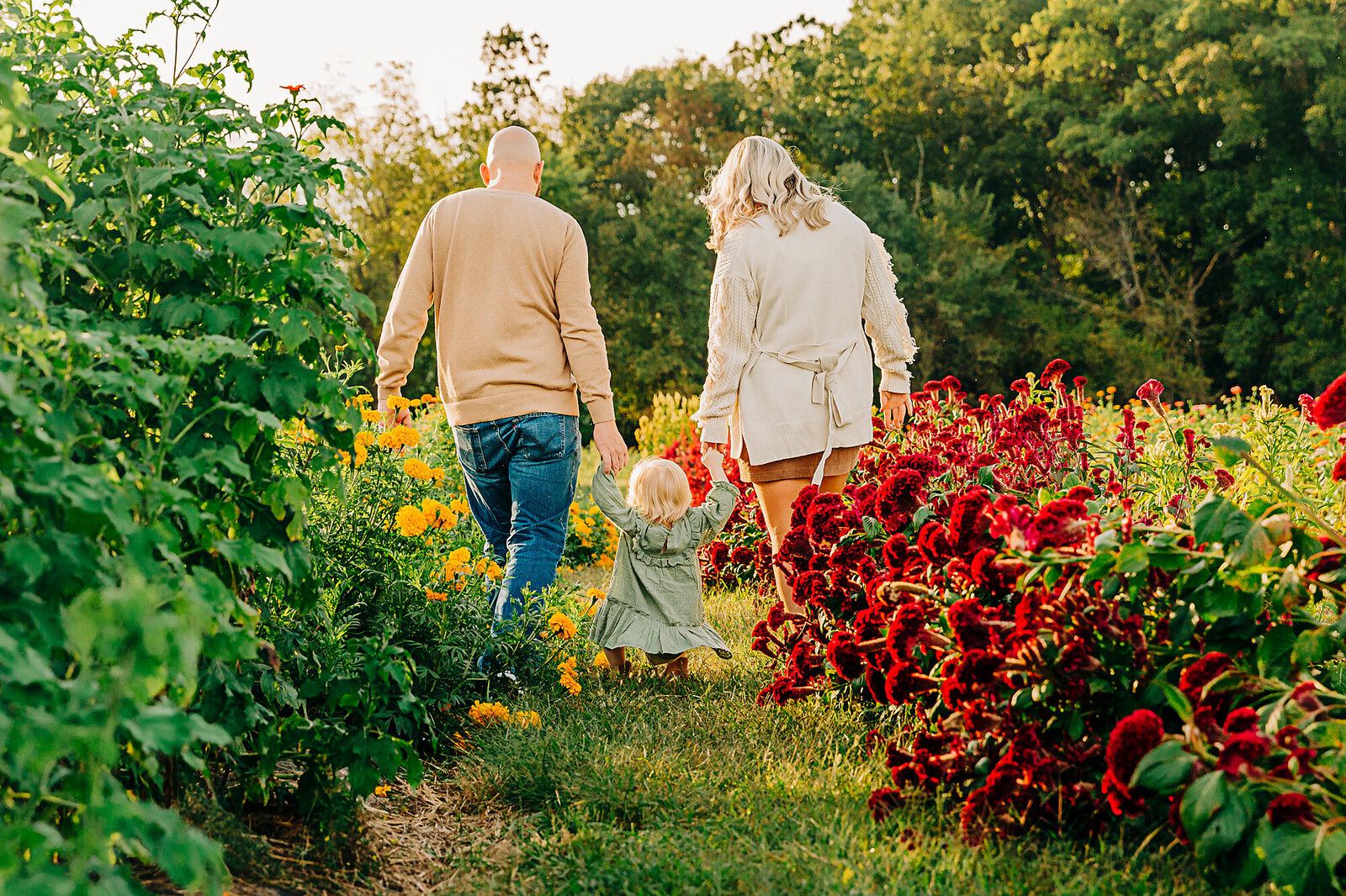 parents walking with toddler girl away from camera by Philadelphia Family Photographer