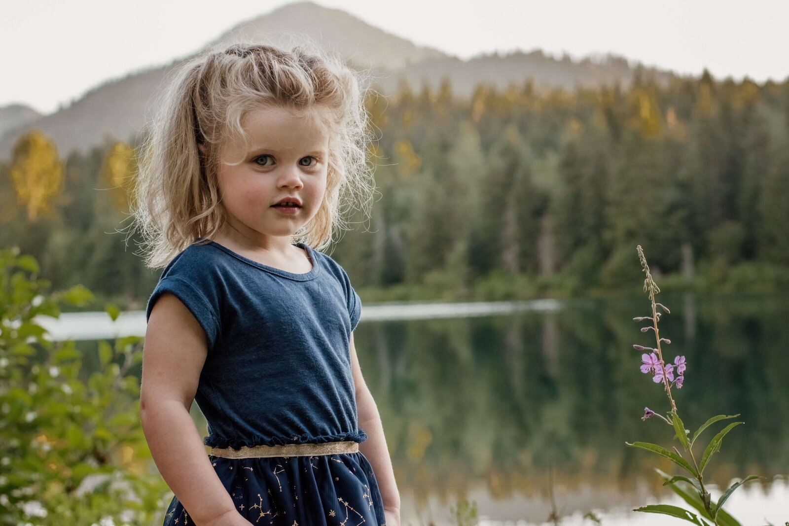 Little girl near pond.